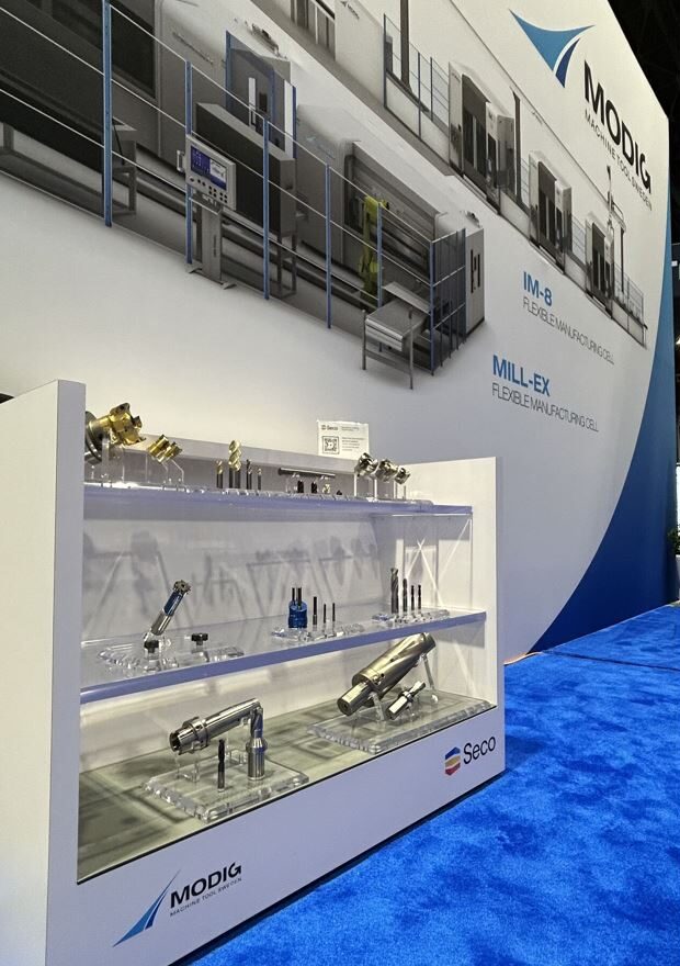 Modig Machine Tool + SECO Tools, displaying IM-8, inverted machining, and tooling at IMTS 2024